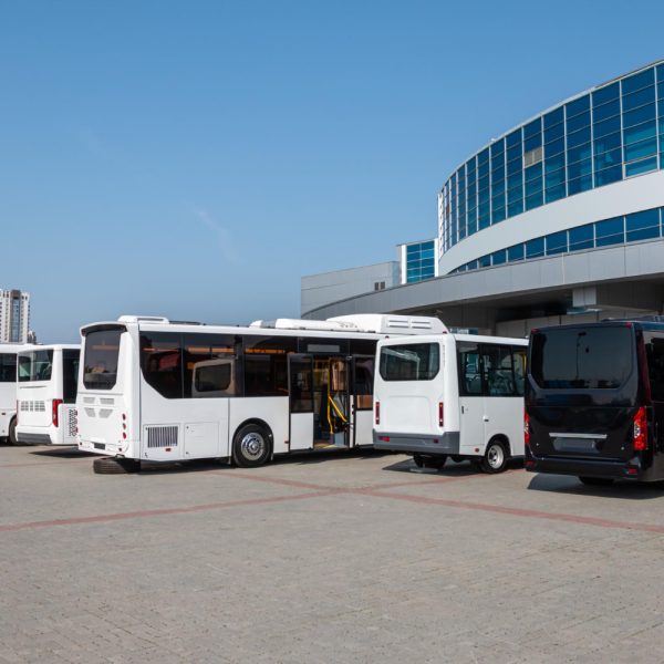 Modern city buses at the bus station on a clear day Modern city buses at the bus station on a clear day